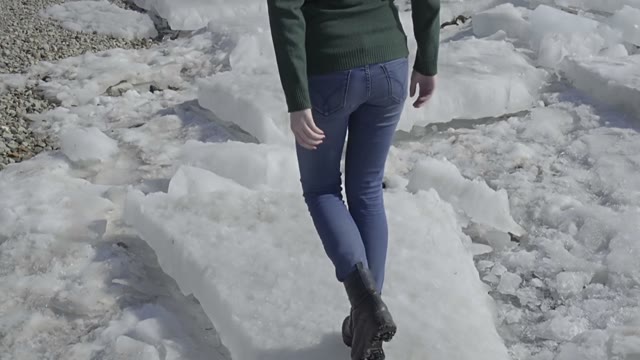 Cute Curly Girl Walking On The River Shore