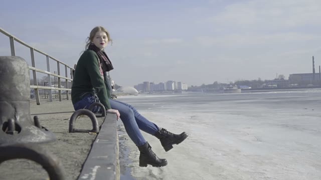 Cute Curly Girl Walking On The River Shore