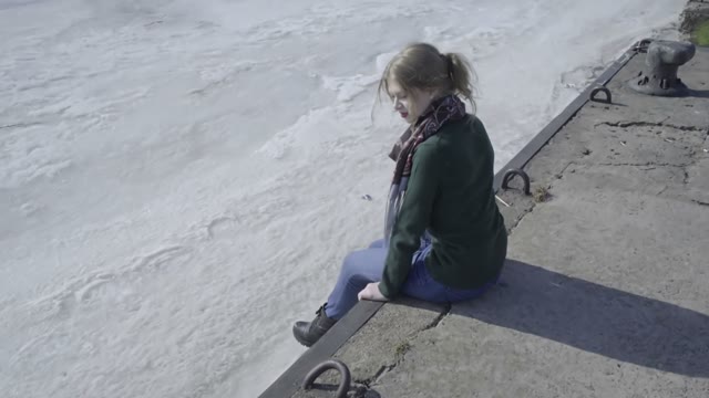 Cute Curly Girl Walking On The River Shore