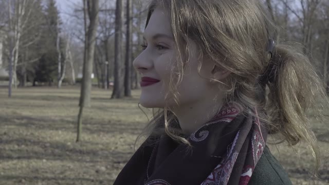 Cute Curly Girl Walking Through The Park