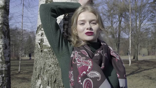 Cute Curly Girl Walking Through The Park