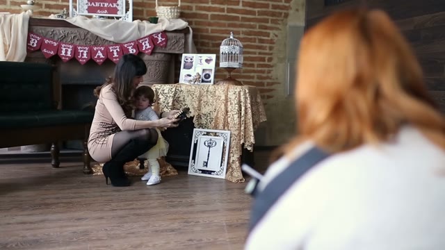People Posing To Be Photographed In The Coffee Bar Decorations
