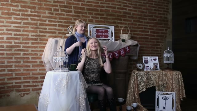 People Posing To Be Photographed In The Coffee Bar Decorations