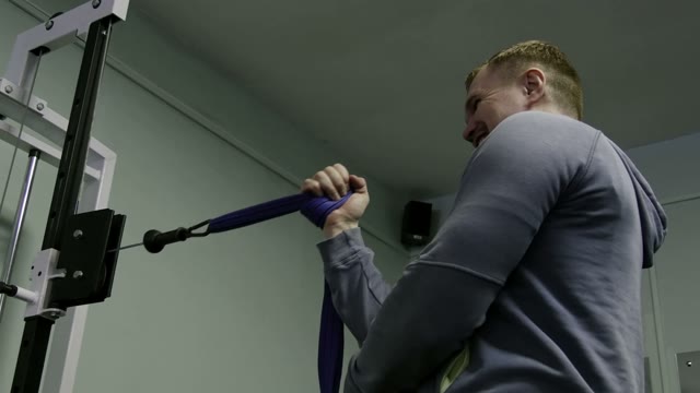Strength Training In The Gym On Simulators