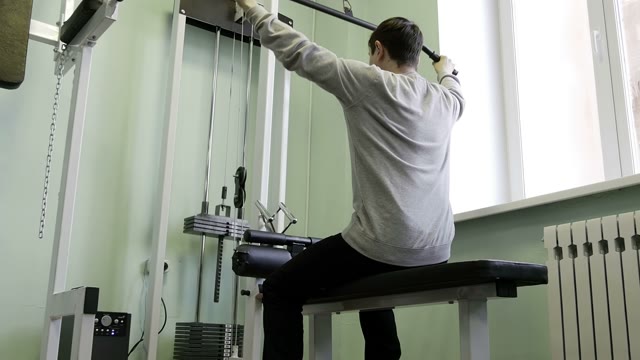 Strength Training In The Gym On Simulators