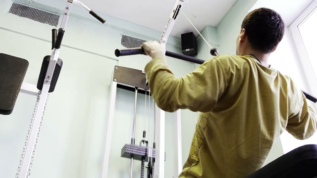 Strength Training In The Gym On Simulators