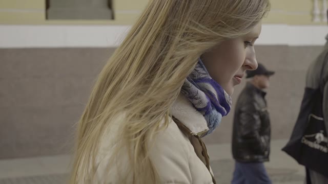 Cute Blonde Girl Walking Along The River Channel