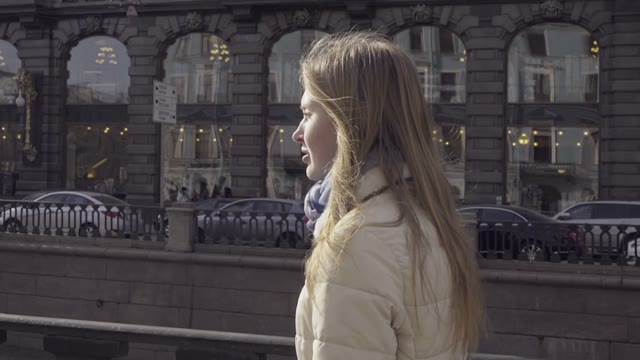 Cute Blonde Girl Walking Along The River Channel