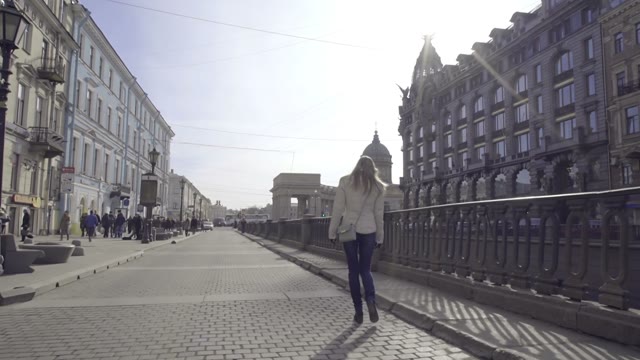 Cute Blonde Girl Walking Along The River Channel