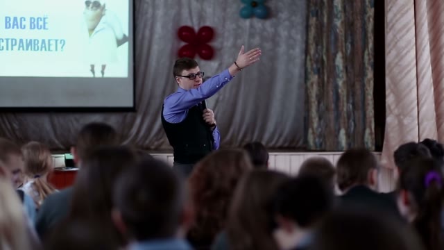 Man Giving A Lecture To An Audience