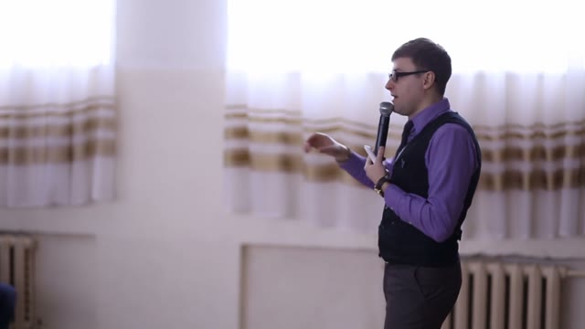 Man Giving A Lecture To An Audience