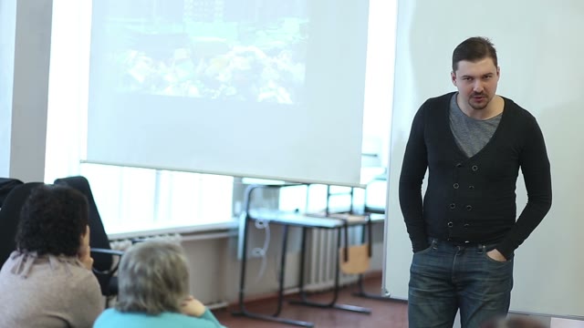 Man Giving A Lecture To An Audience