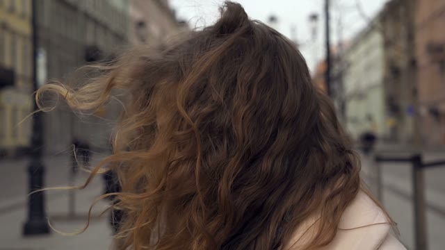 Cute Young Curly Girl Posing In Front Of The Camera