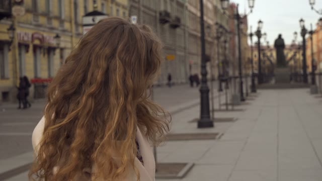 Cute Young Curly Girl Posing In Front Of The Camera