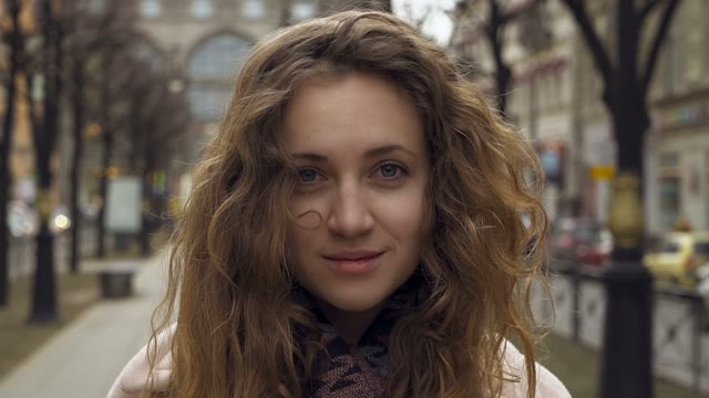 Cute Young Curly Girl Posing In Front Of The Camera