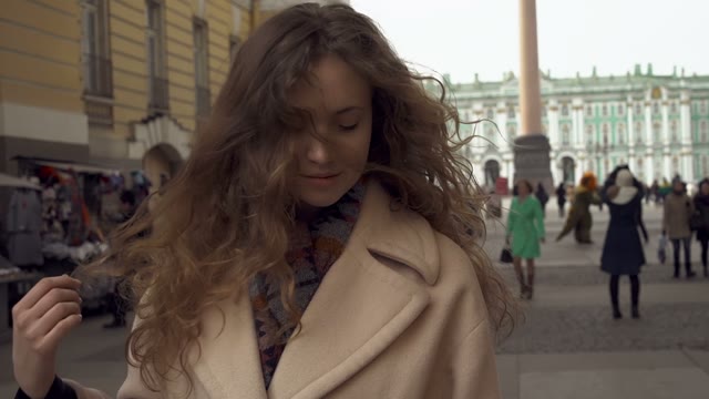 Cute Young Curly Girl Posing In Front Of The Camera