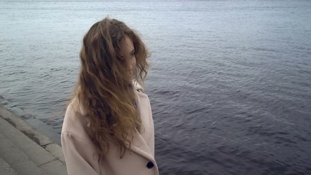 Cute Young Curly Girl Posing In Front Of The Camera