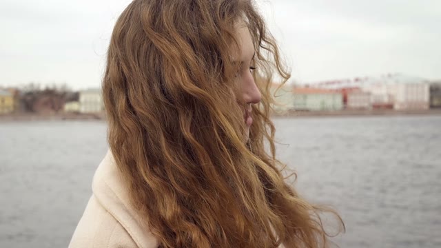 Cute Young Curly Girl Posing In Front Of The Camera