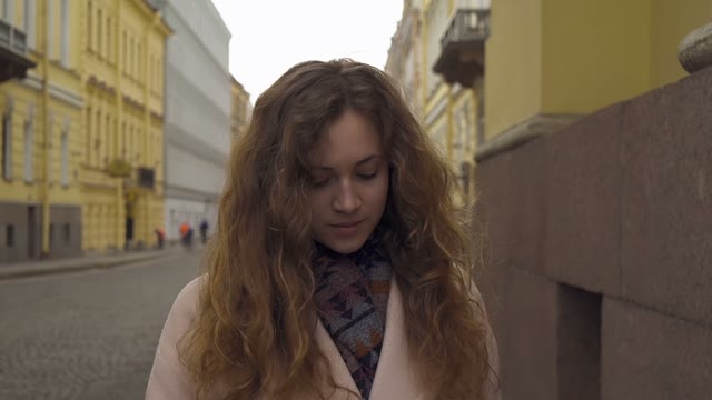 Cute Young Curly Girl Posing In Front Of The Camera