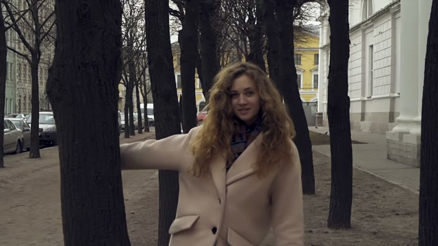 Cute Young Curly Girl Posing In Front Of The Camera