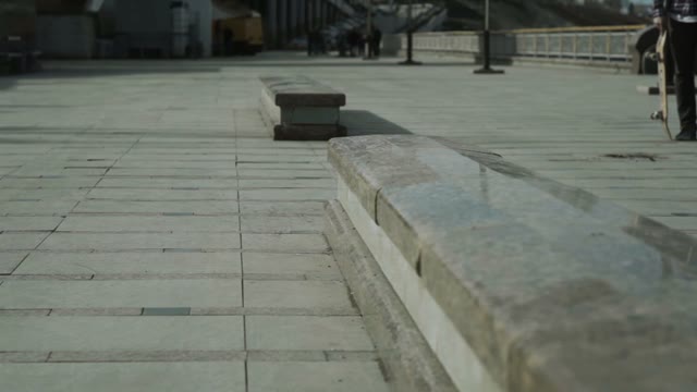 A Young Boy Performs A Trick On A Skateboard