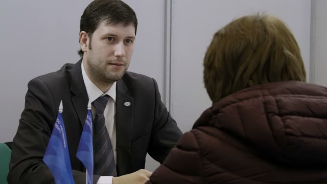 Handsome Businessman Interviewing A Woman That Trying To Get A Job