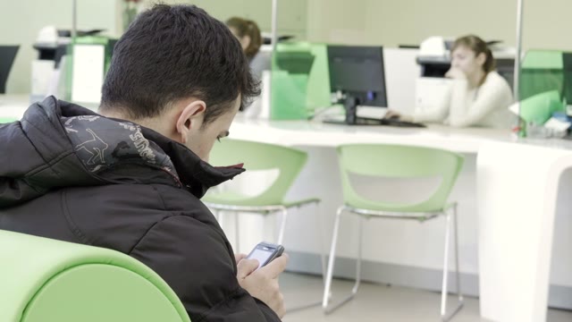 The Guy Waiting On The Sofa In The Reception Of The Business Center