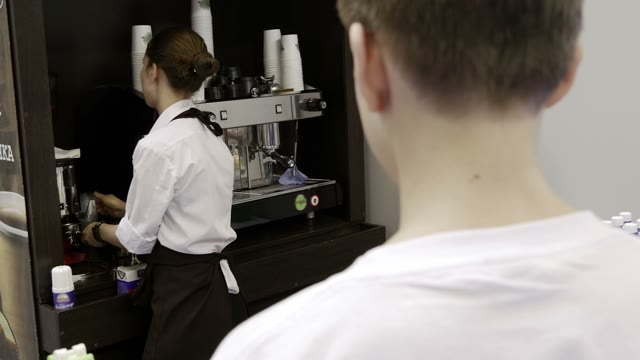 The Girl Pours A Drink For A Visitor