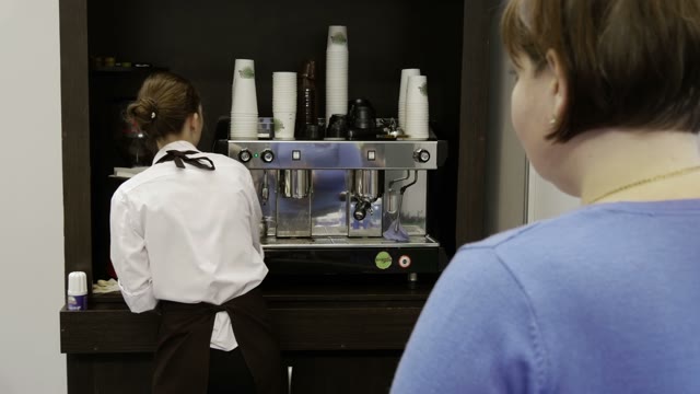 The Girl Pours A Drink For A Visitor