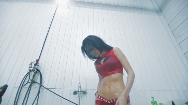 Sexy Girl In A Red Suit Taking Shower