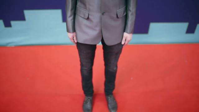 Successful Businessman In A Suit Crosses His Arms