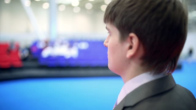 Young Businessman In A Suit Speaks Closeup