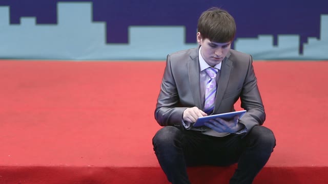 Successful Businessman Works With The Tablet