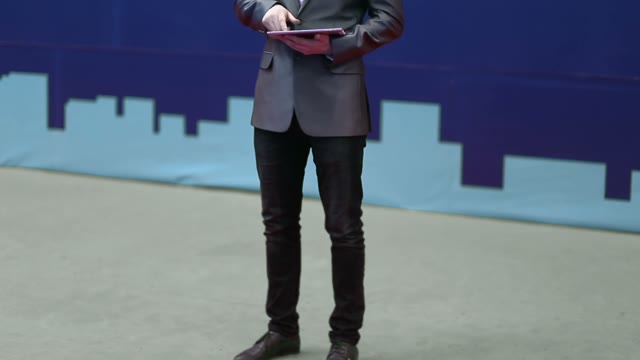 Successful Businessman In A Suit Works With The Tablet