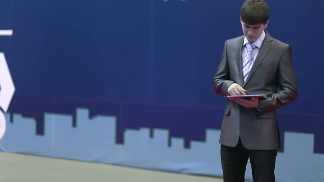 Businessman In A Suit Works With The Tablet