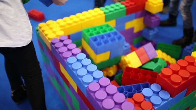 Children Build A House Out Of Lego Bricks Large