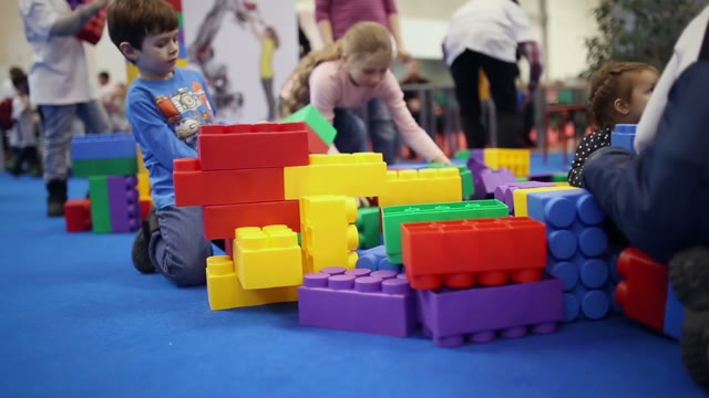 Kids Playing With Large Lego Cubes