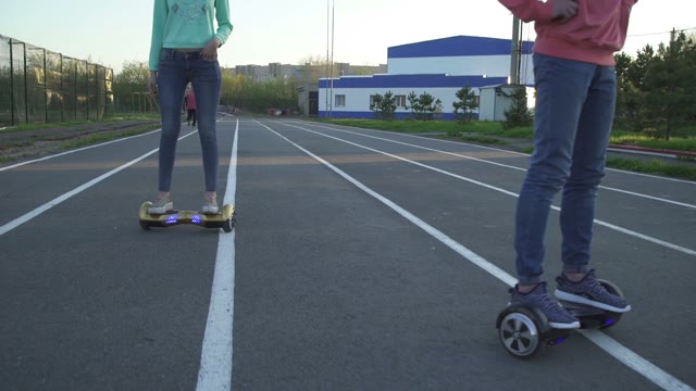 Man And Woman Riding On Hoverboard
