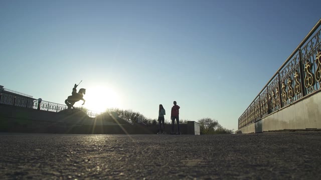 Man And Woman Riding On Hoverboard
