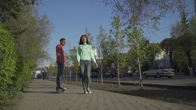Guy Rolls A Girl On A Hoverboard