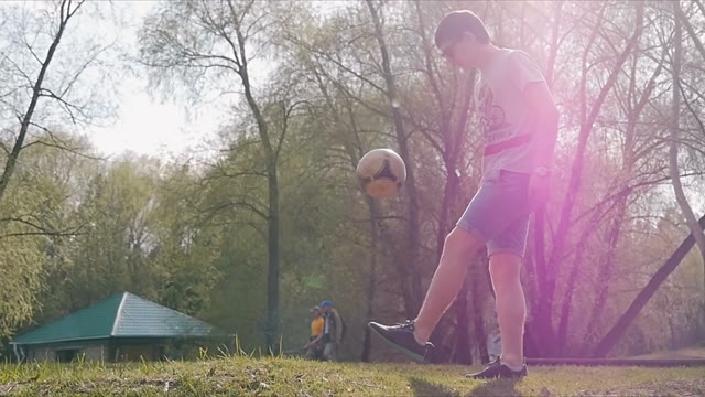 The Man Playing With A Ball On A Background Of Trees
