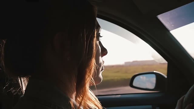 Young Beautiful Woman Driving A Car