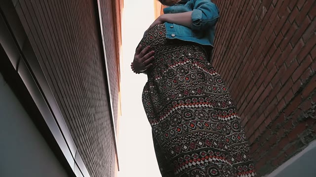 Young Pregnant Woman Stroking Her Belly