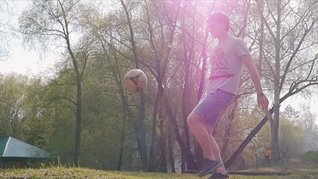 The Young Man Playing With A Ball On The Background Of Nature