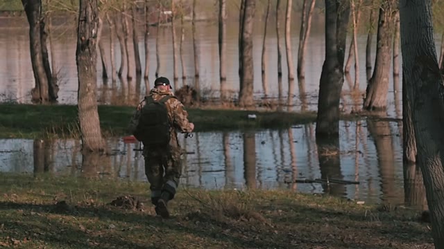 Man With Fishing Rod Goes To The River