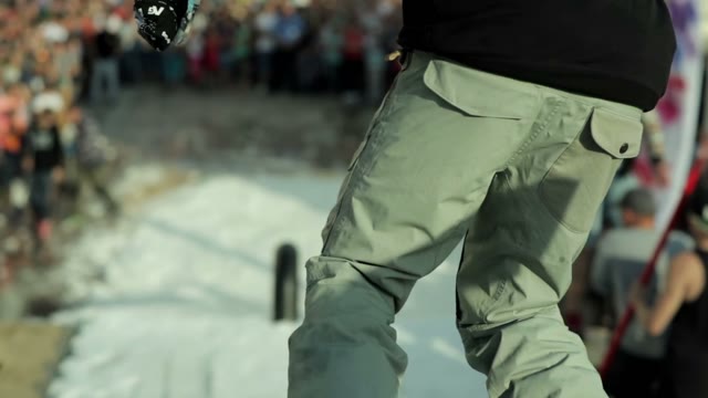 Snowboarder Slides On A Large Railing