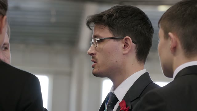 Young Businessman Says Something