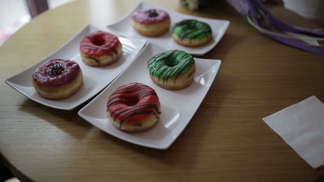 Donuts In A Plate And A Bridal Bouquet On The Table