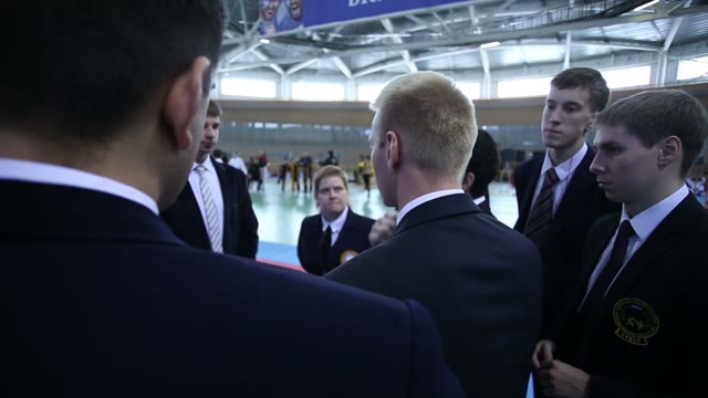 Group Of People In Business Suits Discussing Something