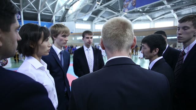 Group Of People In Business Suits Discussing Something